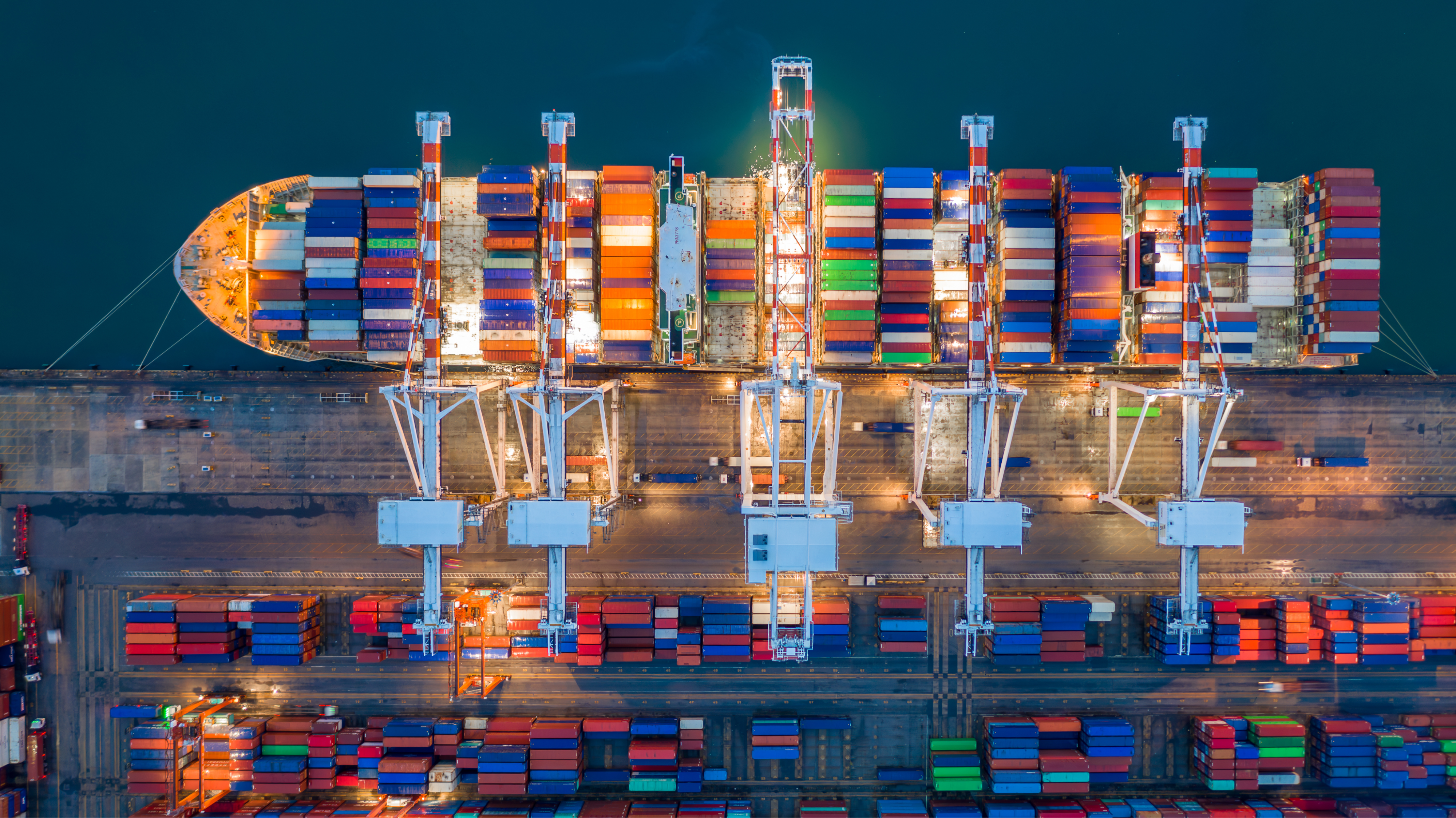 Cargo container ship traveling along global trade routes