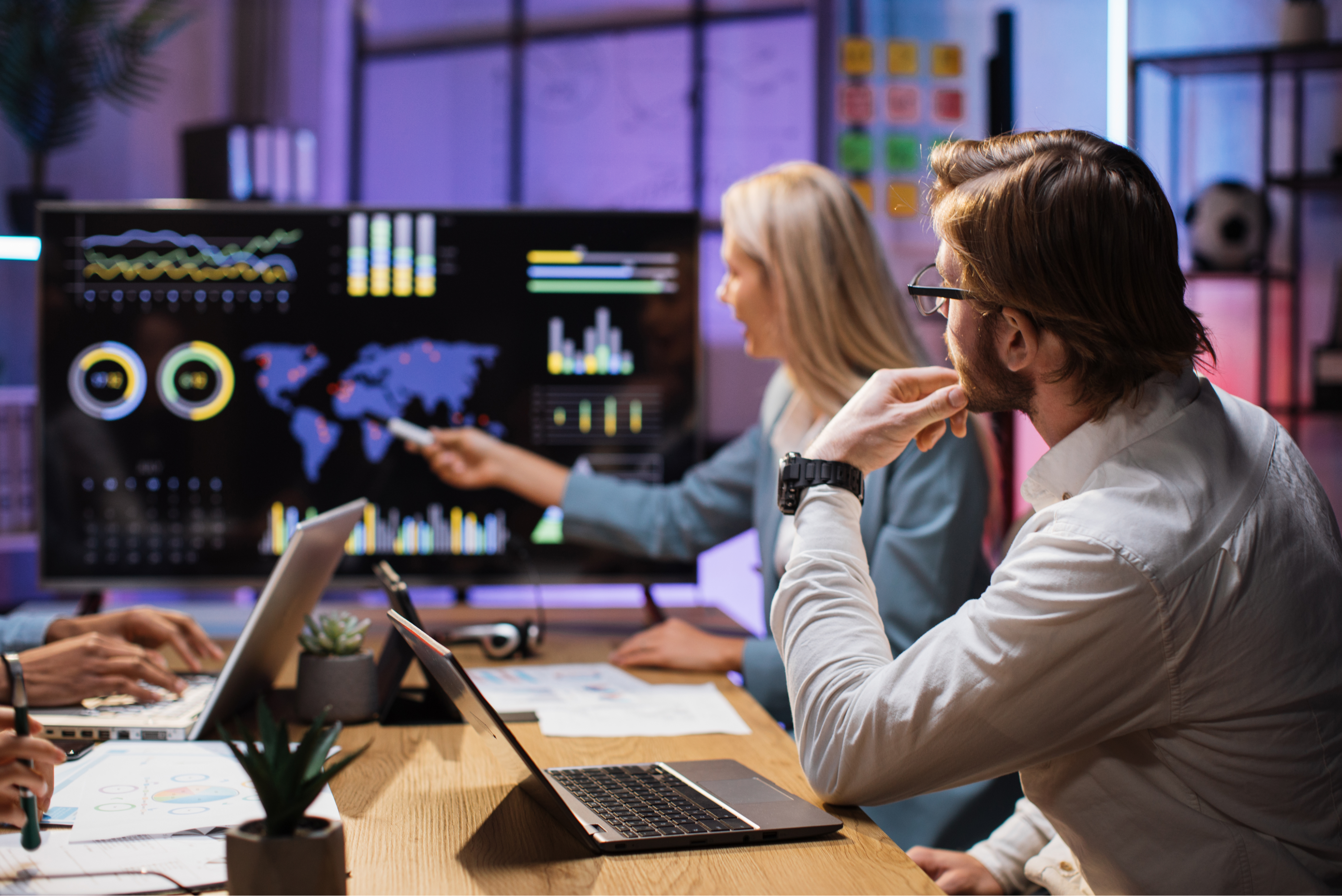 Operations analysts reviewing enterprise performance dashboards